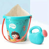 A turquoise plastic container filled with sand and a squeeze bottle for a beach sand toy kit.