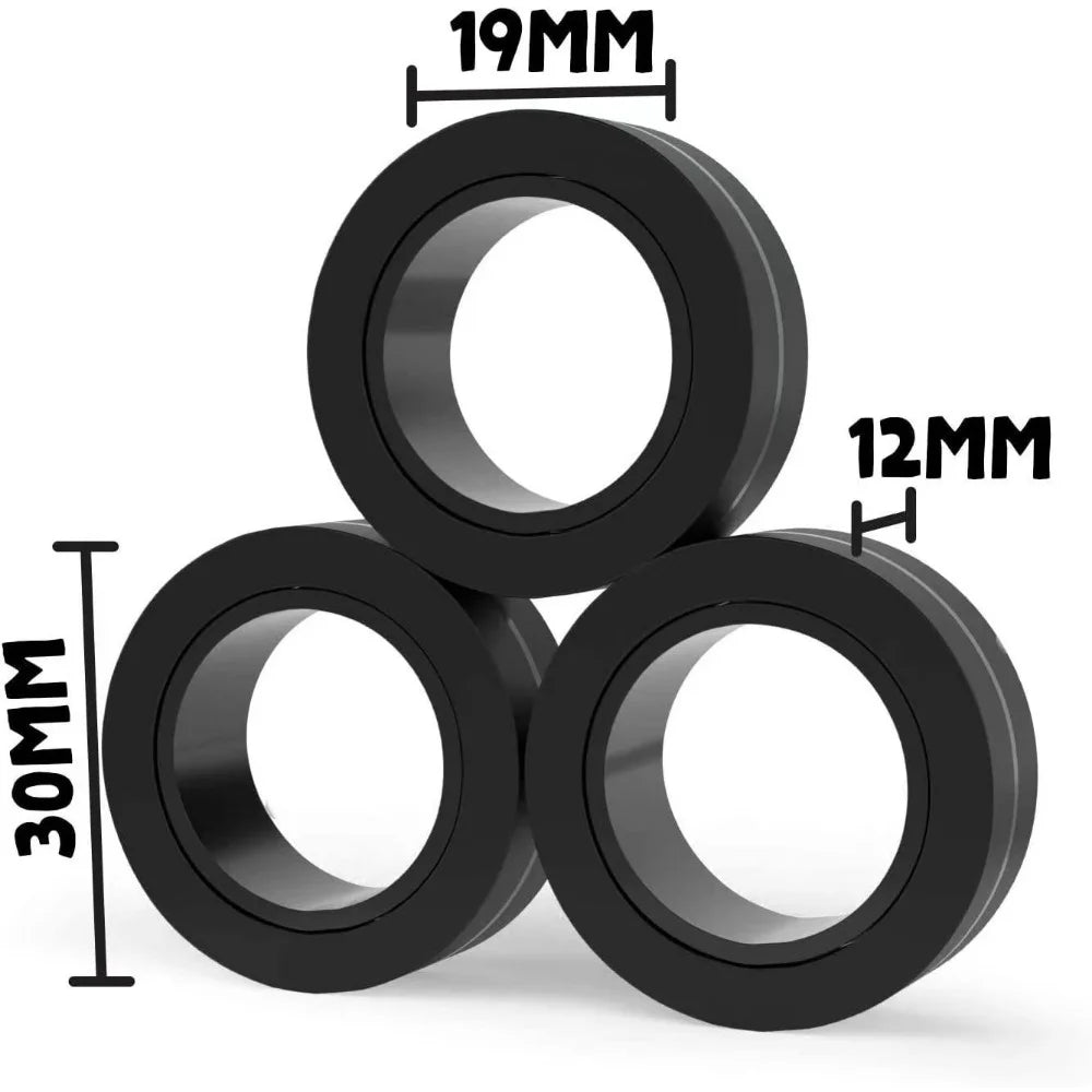 A set of three black magnetic fidget spinning rings shown from above.