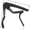 A black 7-piece guitar capo set including picks and a holder shown from the side.
