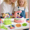 A child is shown crafting a fabric flower bouquet using a DIY kit on a white table.
