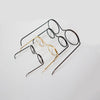 A collection of five metal round glasses frames, including black and gold options, displayed on a white background.