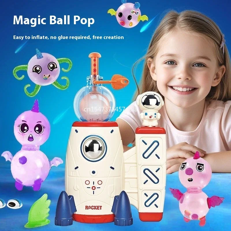 A girl is smiling while holding a Magic Ball Pop kit featuring pink and purple inflatable animals like an octopus and monster