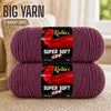 Two skeins of super soft red acrylic yarn for knitting and crochet projects