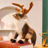 A soft plush reindeer stuffed animal with brown antlers and white fur standing on a red box.