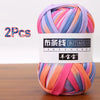 A skein of multi-colored soft chunky t-shirt yarn, packaged as a 2-pack.