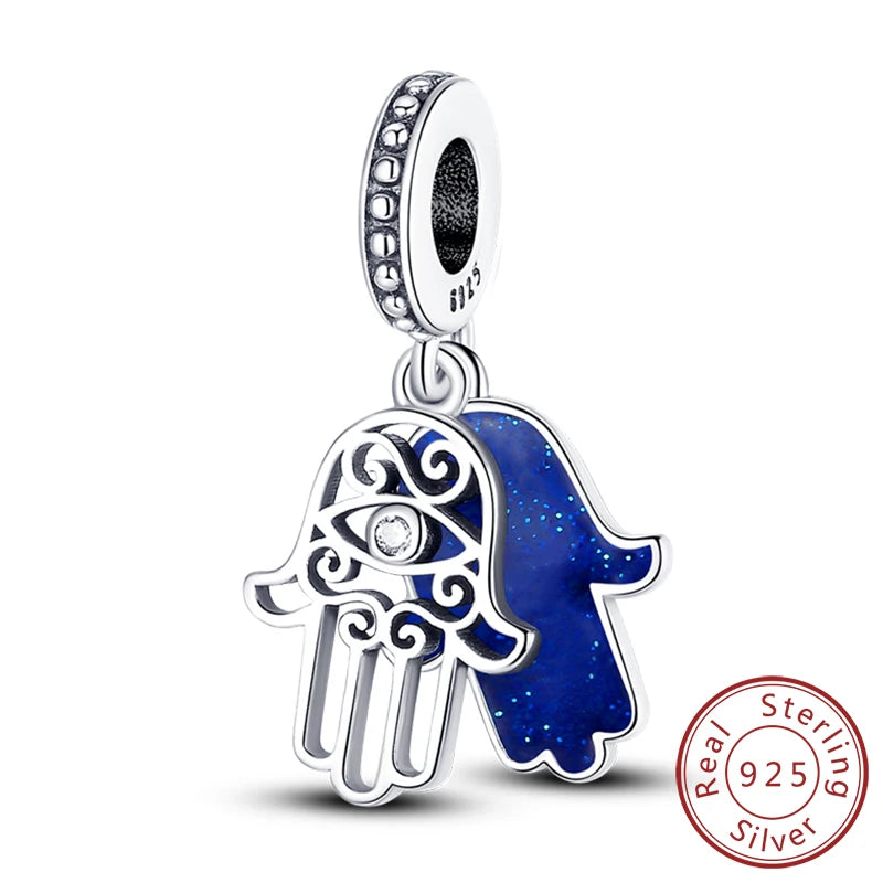 Sterling silver charm beads set featuring cross, angel, and evil eye designs for DIY jewelry making