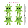 Four green alien cat plush toys displayed side by side.