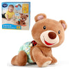A brown teddy bear toy designed for crawling, shown next to its packaging.