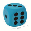 A bright blue jumbo soft foam die with black dots, shown from above.