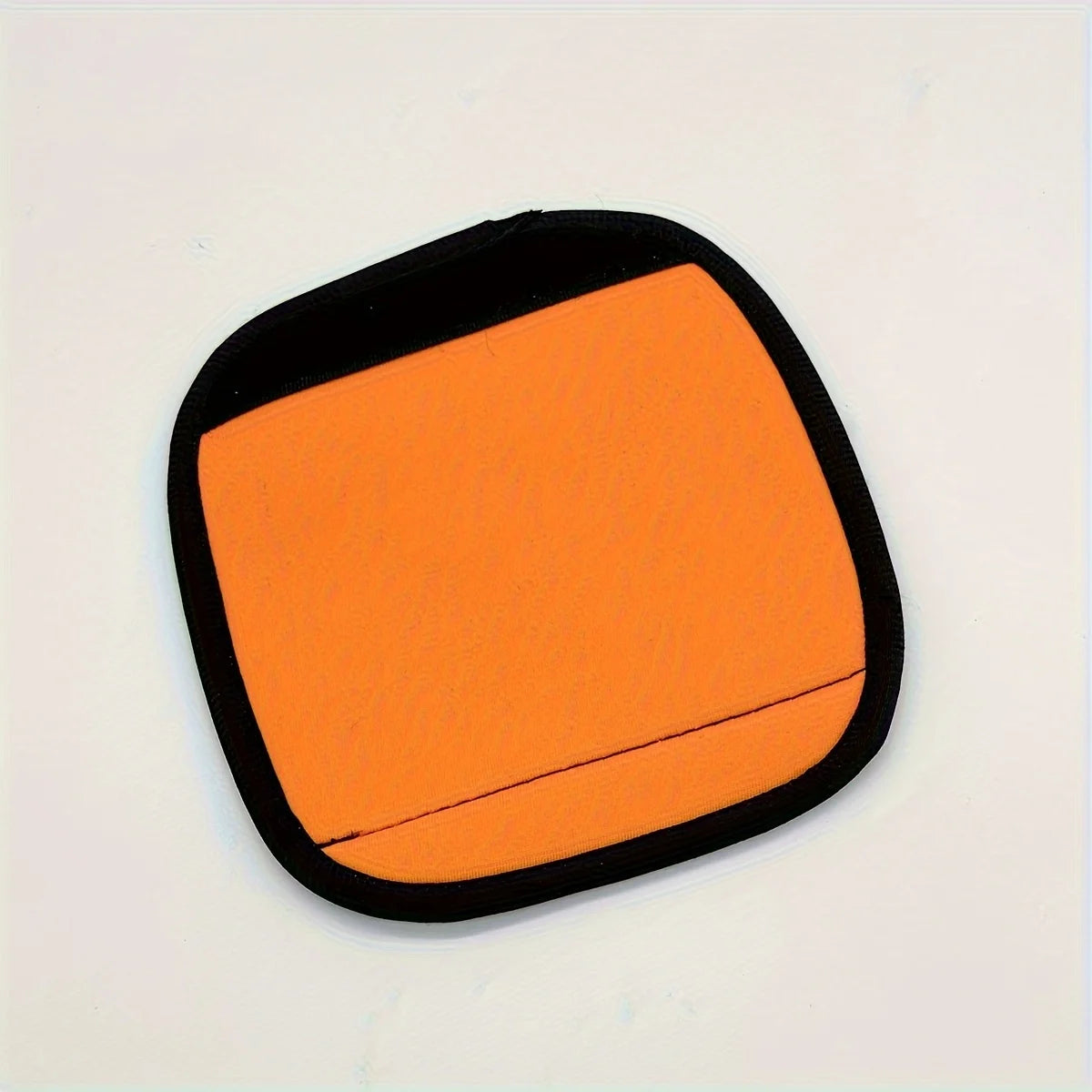 Orange neoprene luggage handle cover with a black cushioned grip.