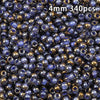 A close-up view of 340 glass beads with a golden gradient finish in various shades of blue and purple.
