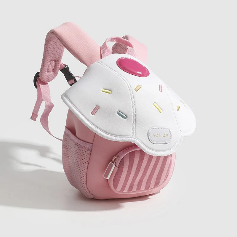 A pink mini backpack with a white, mushroom-shaped design and pink accents.
