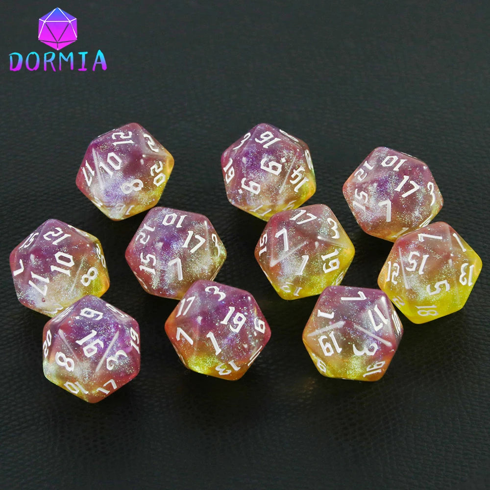 A collection of ten glitter polyhedral dice in mixed colors arranged on a dark surface.