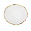A round white resin nail art palette with a gold trim edge.