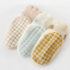 A pack of five beige and cream non-slip cartoon socks with various patterns