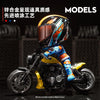A 1:12 scale die-cast motorcycle model featuring a helmeted rider figurine in blue and orange colors.