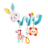 A plush bunny toy with blue accents and a yellow rattle attached to a blue spiral toy.