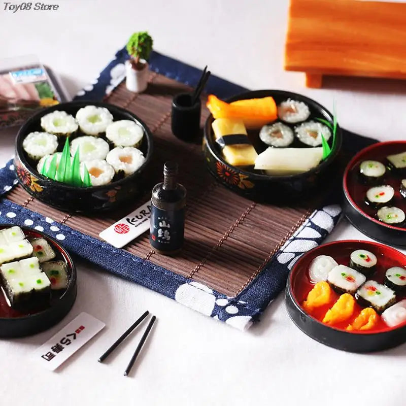 A set of miniature Japanese sushi rolls and ingredients arranged on a wooden board for a dollhouse kitchen display.