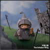 A gray plush doll wearing a conical hat stands in front of a stone castle backdrop.