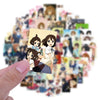 A hand holds a sticker pack featuring cute K-ON! anime characters and guitar girl decals.