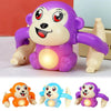 A set of three interactive rolling monkey toys in orange, blue, and purple.
