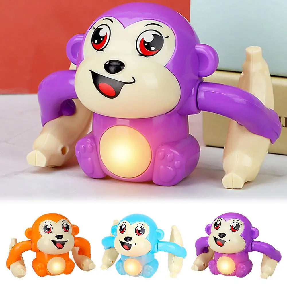 A set of three interactive rolling monkey toys in orange, blue, and purple.