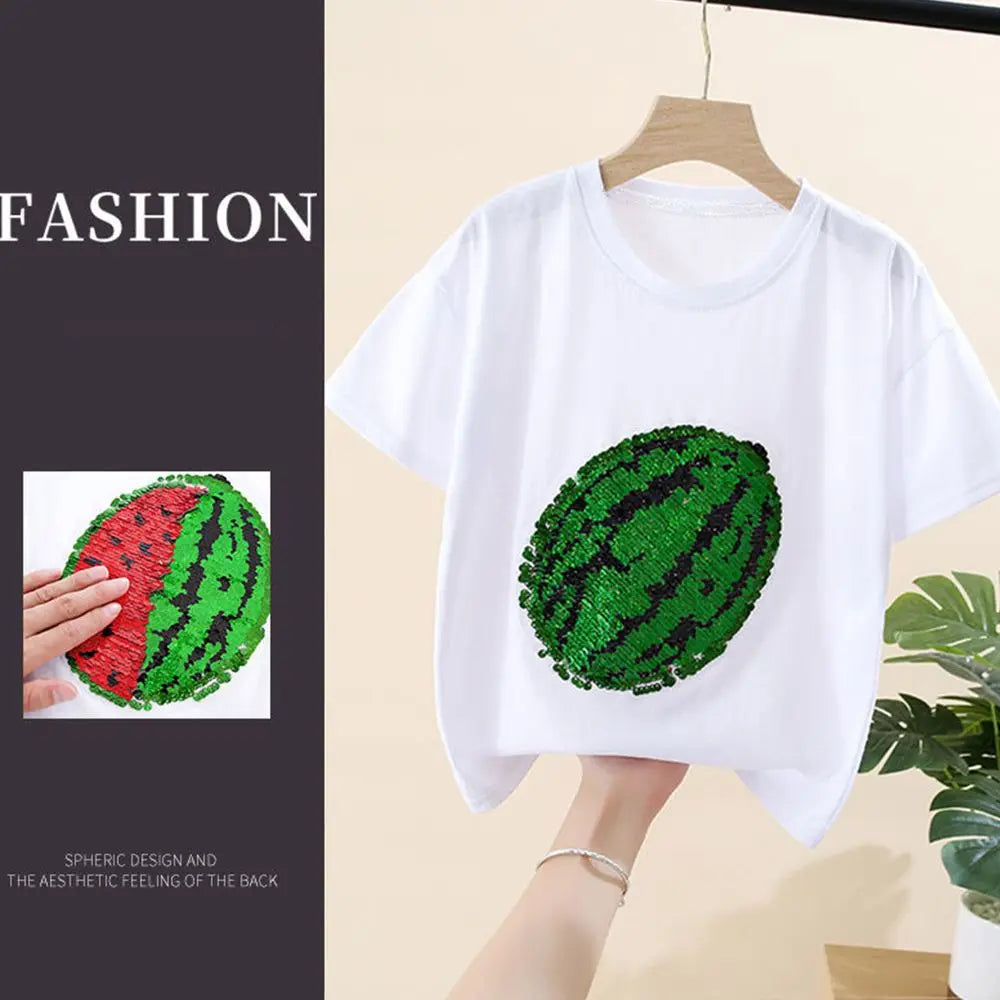 White t-shirt featuring a green sequin watermelon design on the chest.