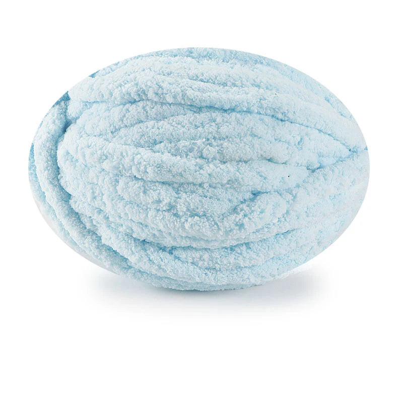 A ball of light blue chunky chenille yarn for hand knitting projects.