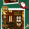 A miniature model of a Christmas street corner featuring a wooden book nook kit.