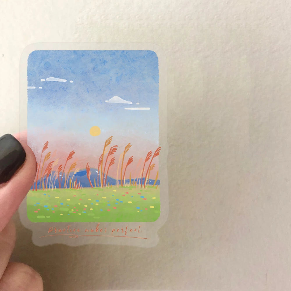 A decorative sticker pack featuring a watercolor landscape of a sunset over mountains and sea with yellow sun and pink sky.