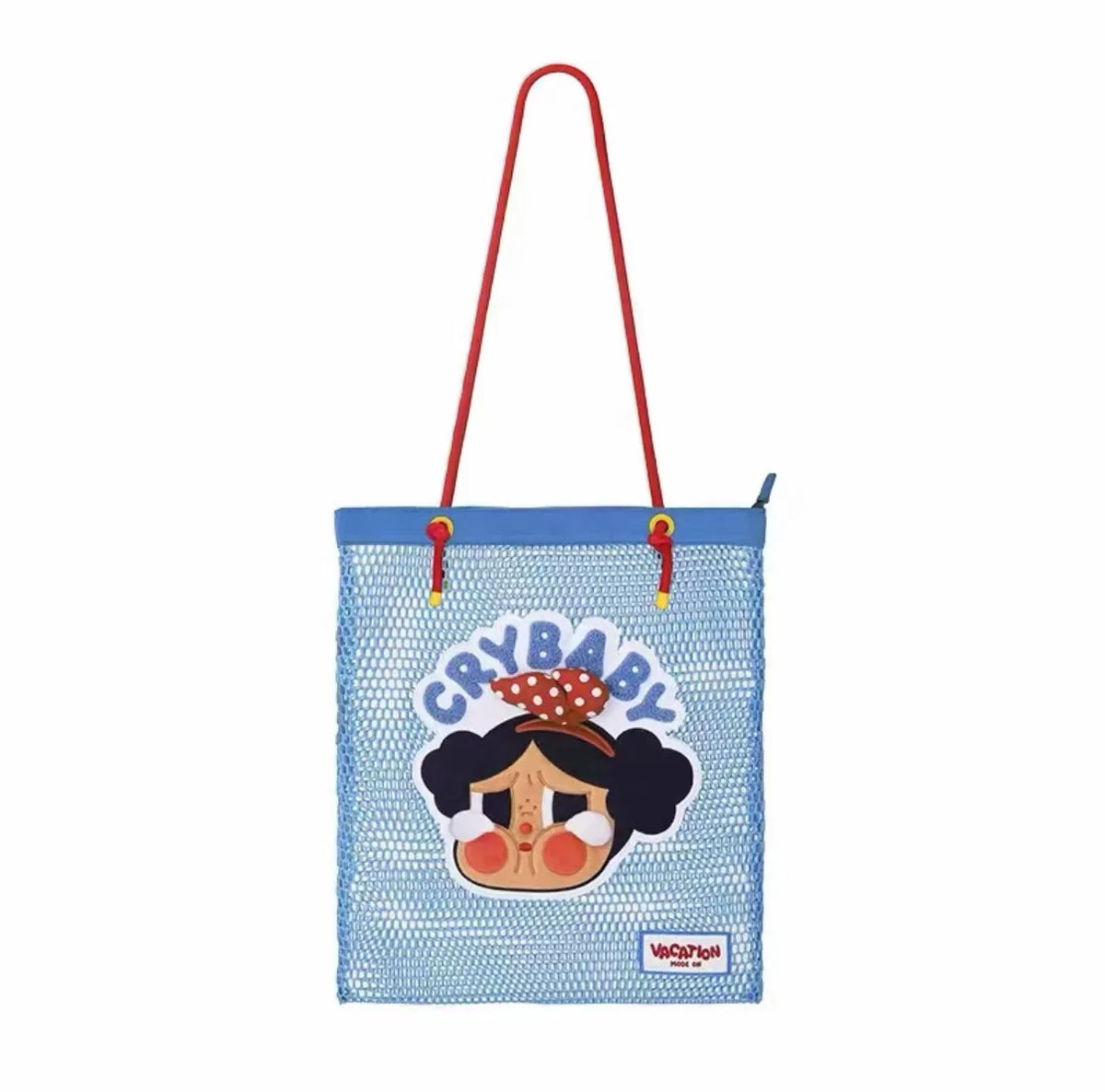 A light blue mesh tote bag with a graphic featuring a crying face and the text Crybaby Vacation Mode On