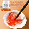 A bottle of Fabric Colour Regulator and a paint applicator dipping into a bowl of red paint.