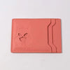 A pink leather card holder wallet featuring a cutout design of a superhero cat face.