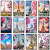 A collage of various artistic depictions of the Eiffel Tower in different colors and settings.