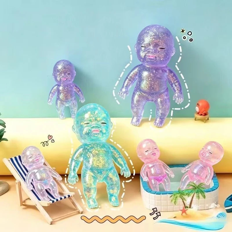 A collection of purple and blue squishy baby stress relief toys, including figures and a bathtub, displayed on a light backgr