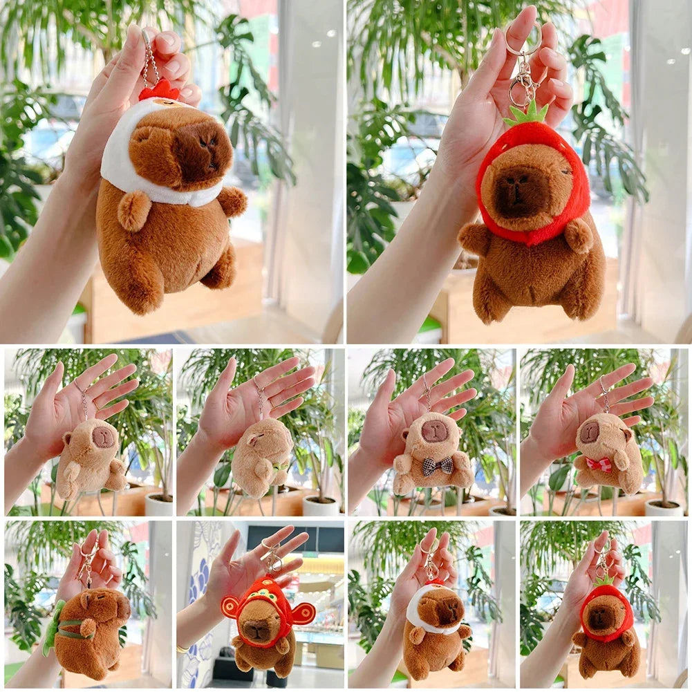 Adorable capybara plush keychain charms in various colors and styles