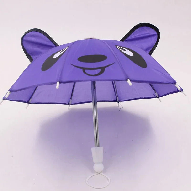 A purple bear face umbrella with black accents and lace trim.