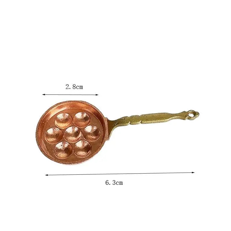 Miniature copper soup pot with a handle and a round base for dollhouse kitchen