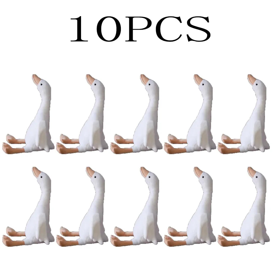 Ten white goose plush toys arranged in a row.
