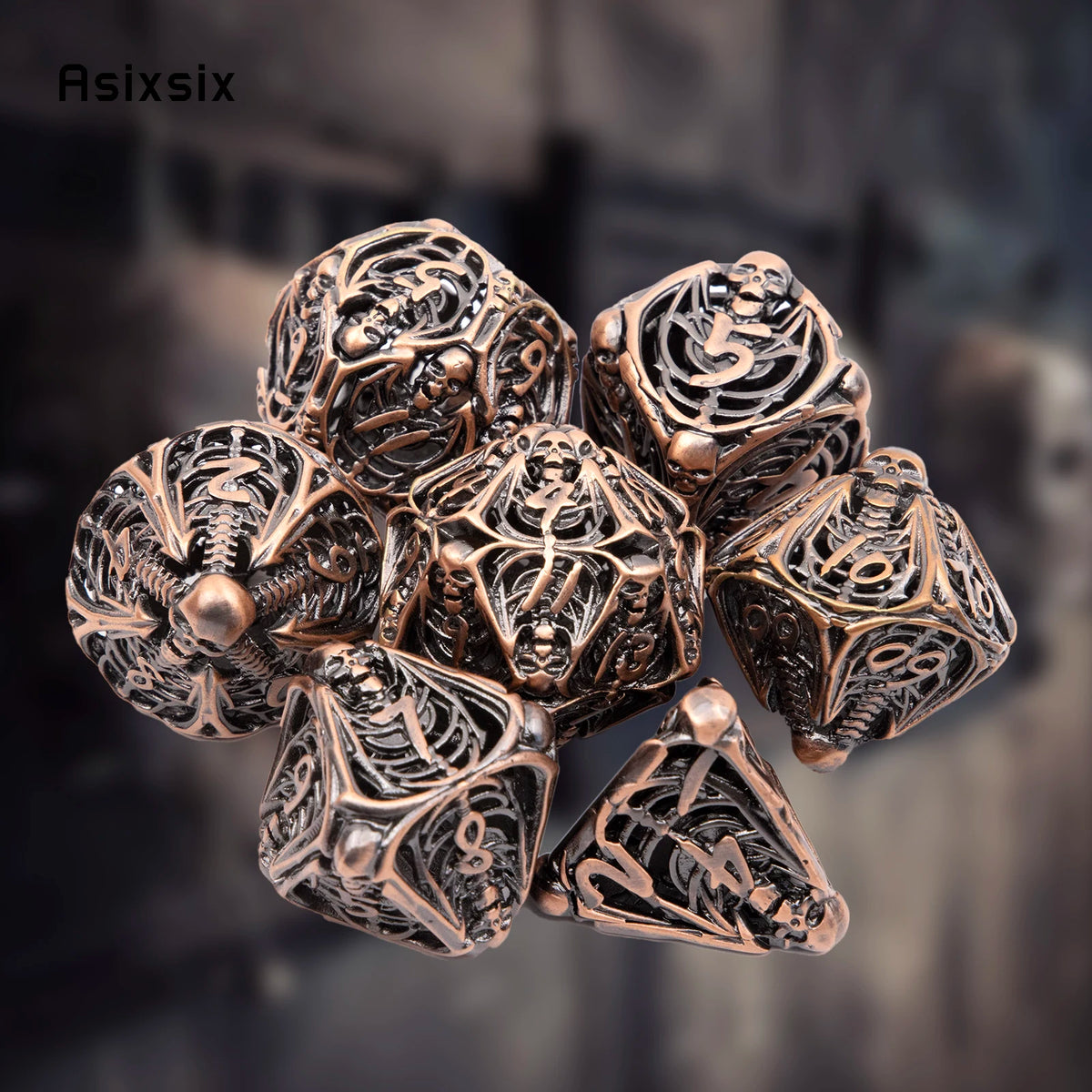 A set of coppery skull metal polyhedral dice for tabletop role-playing games