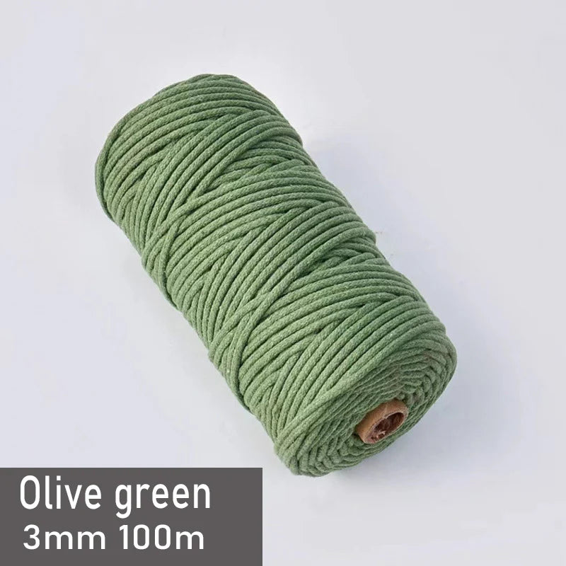 Olive green 3mm cotton macrame cord in a spool, measuring 100 meters.
