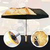 A black umbrella featuring a Demon Slayer Katana design with gold accents and a character illustration.