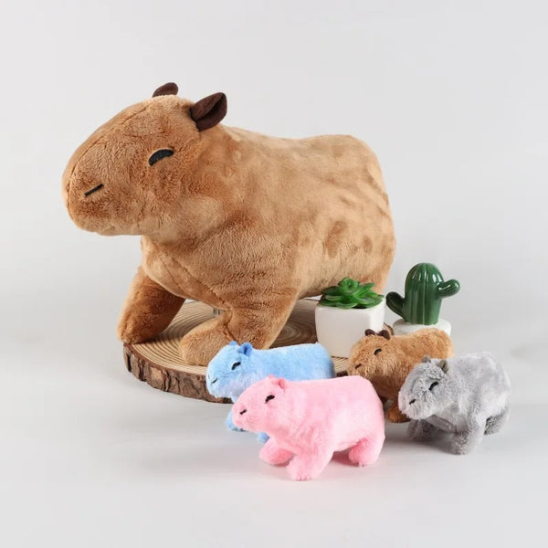 A brown plush simulation of a cow standing next to small, colorful animal figures.