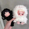 A hand holds a Skullpanda You Found Me! Series Mystery Box collectible figure with fluffy white hair and dark features.