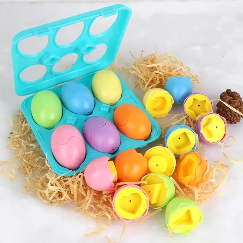 A blue plastic egg sorter with multiple colored eggs and a wooden nest of straw surrounding the toys.