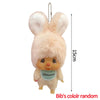A light pink fluffy rabbit plush cartoon charm with long ears and a green collar.