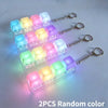 Two clear LED fidget keychains with random colored buttons and metal clasps