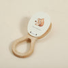 A wooden hand slapstick toy featuring a bear illustration for toddlers.