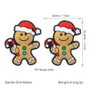 A festive Christmas silicone bead shaped like a gingerbread man with a red and white Santa hat.