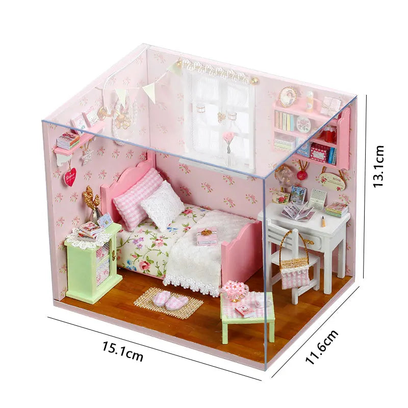 A pink wooden miniature dollhouse kit featuring furniture and decorative elements.